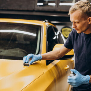man car service doing car ceramic procedure
