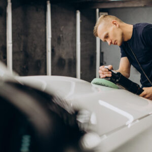 man polishing car with orbital applicator