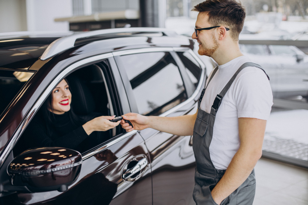 mechanic with client car service station