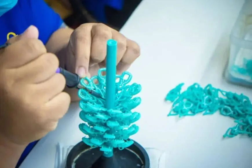 Wax Tree Pattern Assembly Worker assembling wax patterns onto sprue to form wax tree (ID#3)